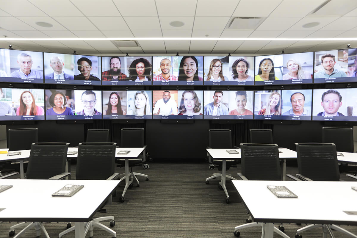 Fourteen video screens showing participants taking part in a digital classroom lecture.