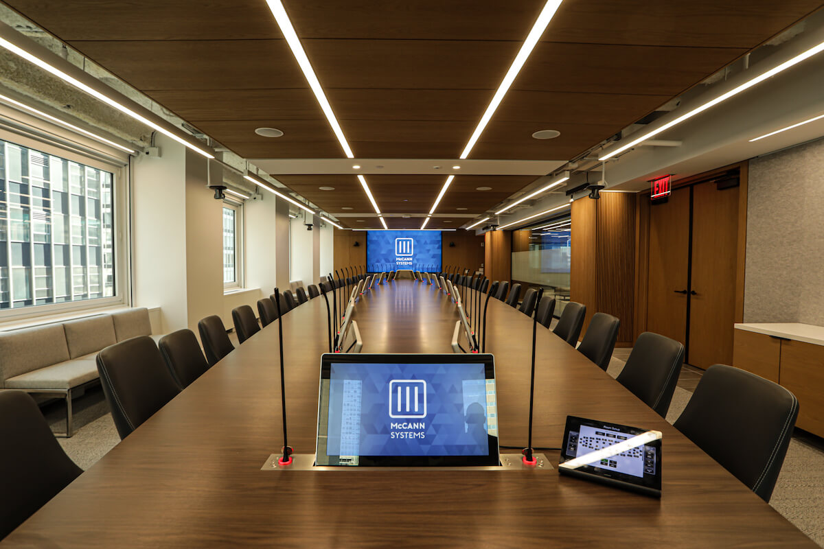 Executive board room where each individual seat is outfitted with a personal display that robotically emerges from the table.