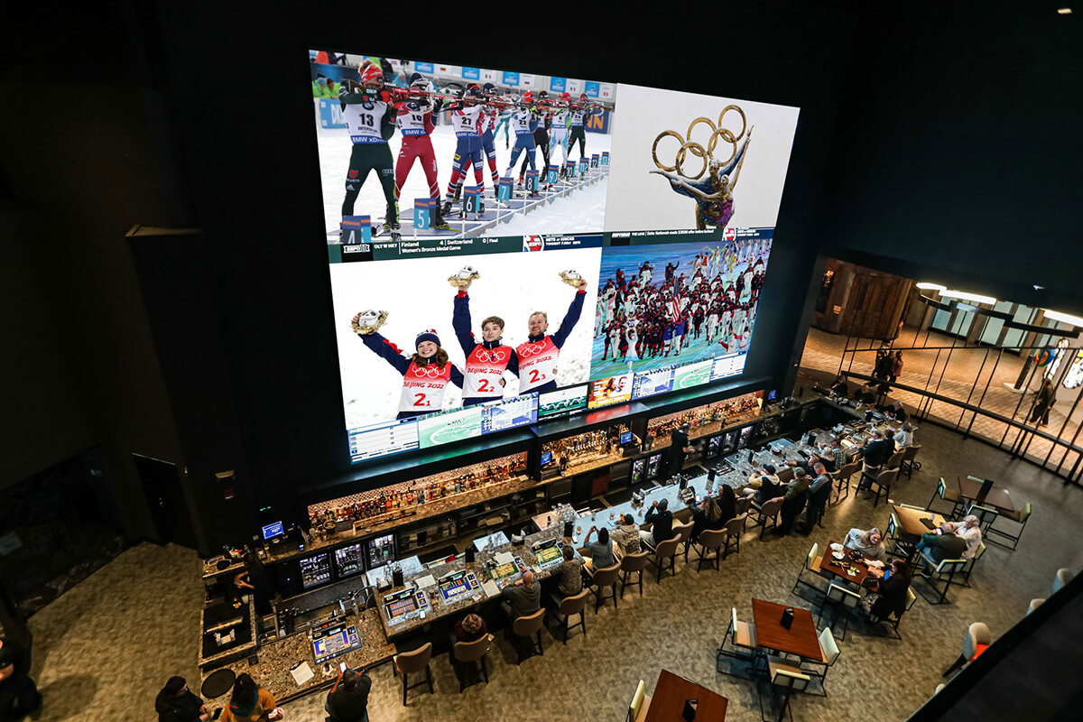 Gigantic video wall showing Olympic sports behind the bar at the Foxwoods Resort Casino sportsbook in Mashantucket, CT.