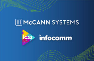 McCann Systems and infocomm logos.