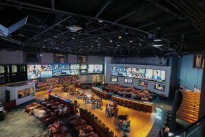 A casino sports betting area utilizing LED video walls for various content and information.