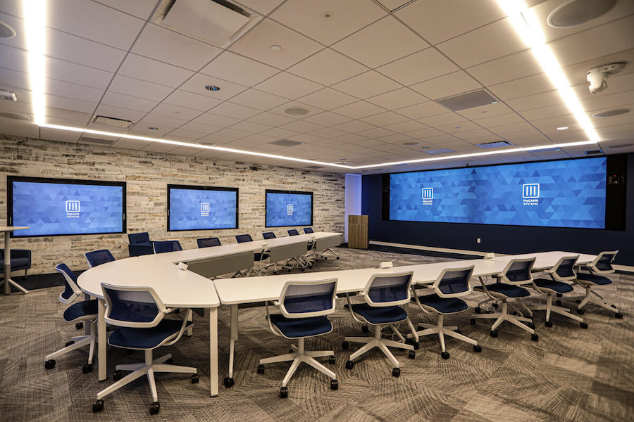 A large conference room space featuring AV technology