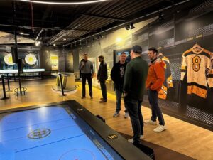 A group of people at the Boston Bruins Heritage Hall Museum at TD Garden.