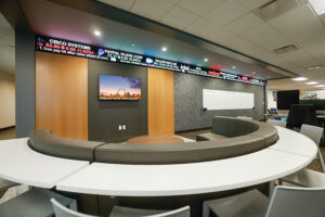 Conference room system with displays reading “Bluebird Bio.”