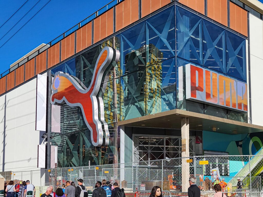 Puma store exterior with oversized Puma logo and glass facade
