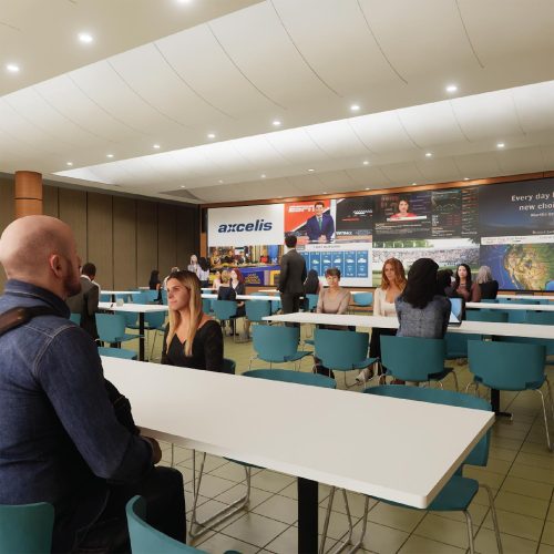 Design-Consulting-Topic-2 Cafeteria-style space with people seated and video walls displaying live content