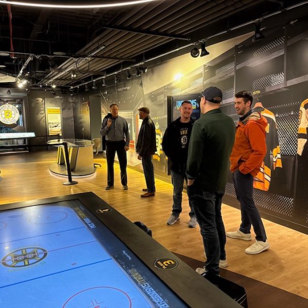 A group of people at the Boston Bruins Heritage Hall Museum at TD Garden.