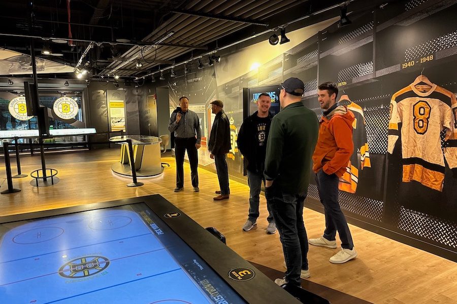 A group of people at the Boston Bruins Heritage Hall Museum at TD Garden.